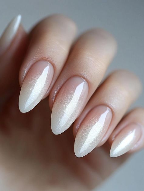 Transform your hands into elegant masterpieces with our selection of 22 breathtaking almond nail designs. This sophisticated shape elongates your fingers and adds a touch of refinement to every gesture. Explore the endless possibilities of nail art with these versatile and flattering almond canvases. Bride Nails Almond Shape, Bridal Nails Almond, Bridal Nails Almond Shape, Almond Nail Trends, Glitter Almond Nails, Elegant Bridal Nails, Almond Nail Designs, Wedding Manicure, Glitter Accent Nails