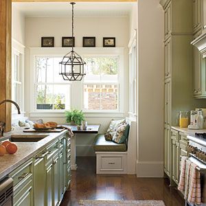 Idea House Kitchens | Galley kitchen | SouthernLiving.com  sage green cabinets & knobs, light fixture Nook Window, Southern Living Rooms, Built In Breakfast Nook, Kitchen Ikea, Sage Green Kitchen, Galley Kitchens, Small Space Kitchen, Galley Kitchen, Kitchen Nook