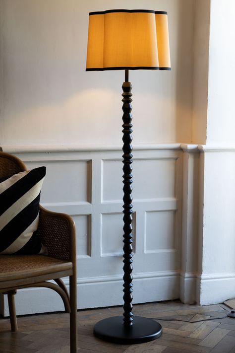 The Black Spindle Floor Lamp With Scalloped Shade combines classic design and trend-led style. A beautiful addition to your living room, hallway or bedroom, the black wooden floor lamp base is designed in homage to bobbin furniture, with the update of asymmetric hexagon shapes in contrast to the bobbin trend’s signature round design. Perfect for modern floor lamp lovers and those with an eye for vintage-inspired style, the black floor lamp features a gorgeous, scalloped lampshade in a natural hu Black Floor Lamp Living Room, Black Wooden Floor, Stained Glass Lighting, Wooden Floor Lamp, Antique Floor Lamps, Wooden Floor Lamps, Unique Floor Lamps, Modern Floor Lamp, Floor Lamp Base