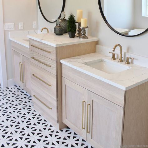 Village Home Stores on Instagram: “Want an updated look for a double sink vanity? Raise up a center storage section to divide the sinks and add interest with a deeper and…” White Oak Double Vanity, Oak Double Vanity, Oak Vanity Bathroom, Black Farmhouse Kitchen, Kitchen Village, Aspen Homes, Black Kitchen Design, Gold Lighting, Black Mirrors