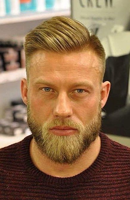 This beard style has a pointy angular chin that looks like a duck’s tail. The sides are kept very short and the length is kept upwards; the jawline is shaped like a square to form a 90-degree connection at the point where the jawline of the beard ends. Haircuts Thick Curly Hair, Make Your Face Slimmer, Men's Beard Styles, Thinner Face, Face Slimmer, Viking Beard Styles, Chin Beard, Best Beard Growth, Ducktail Beard