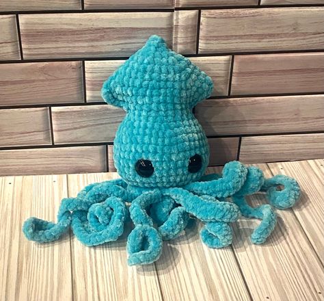 Adorable handmade crochet teal squid. A plushie made special and with love out of Premier Parfait Chunky yarn. - Made with soft, chunky yarn - Soft filling - Measures approximately 6in tall and 4in wide with tentacles measuring 3in long - Safety eyes (be cautious with children 3 years of age and younger, they are secured but can be pulled out) The item is premade so it will be shipped in 2-3 business days. Crochet Squid, Parfait Chunky Yarn, Plushie Amigurumi, Crochet Dreams, Custom Plush, Amigurumi Animals, Chunky Crochet, Safety Eyes, Chunky Yarn