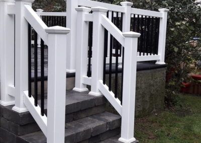 Vinyl/Aluminum Railings | Liberty Fence & Railing White House Black Stairs Exterior, Aluminum Railing Stairs, White Porch Railing, Black And White Porch, Aluminum Porch Railing, Porch Handrails, Black And White Stairs, Aluminum Railings, Fence Railing