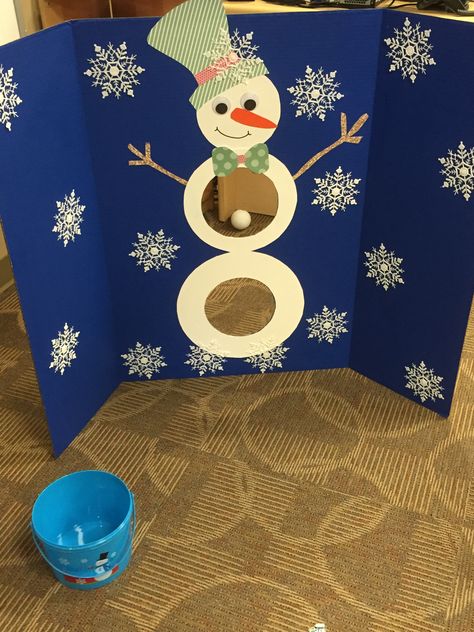 Diy snowman ball toss game. I used styrofoam balls, not a great idea. I'll use something softer next time. I made it for my sons pre school class and they loved it. I had a bucket full of prizes from the dollar store. I guess you could say that I nailed it!!! Snowball Toss Game, Snowball Toss, Christmas Tree Game, Christmas Party Games For Kids, School Christmas Party, Diy Christmas Party, Christmas Games For Kids, Fun Christmas Games, Winter Wonderland Party