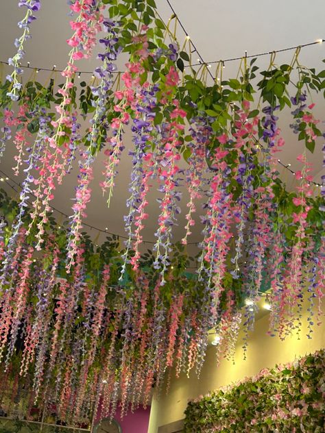 Hanging Flower Bedroom, Hanging Flowers Ceiling Diy, Plant Ceiling Decor Hanging, Flower Vine Bedroom, How To Hang Wisteria From Ceiling, Flower Ceiling Diy Bedroom, Floral Ceiling Bedroom, Ceiling Flower Decoration, Flower Ceiling Decor