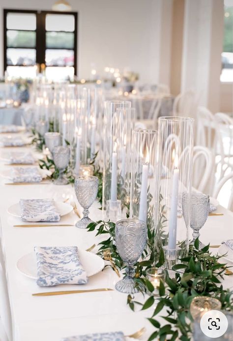 Blue Candles Wedding Table, Blue And White Candle Centerpiece, Coastal Candle Centerpieces, Clear Glass Wedding Table Decor, Blue And White Candle Centerpieces, Wedding Ideas White And Blue, Light Blue Greenery Wedding, Vintage Blue Table Setting, Blue Tapered Candles Wedding