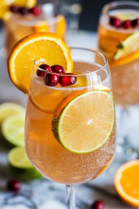 A photo of a  Glittering Prosecco Punch a New Years Cocktails New Year’s Eve Party Drink Ideas, Nye Drinks For A Crowd, New Years Drinks For Kids, Nye Punch, New Years Eve Punch, Nye Drink Ideas, New Years Punch, New Year Cocktails, New Years Drink