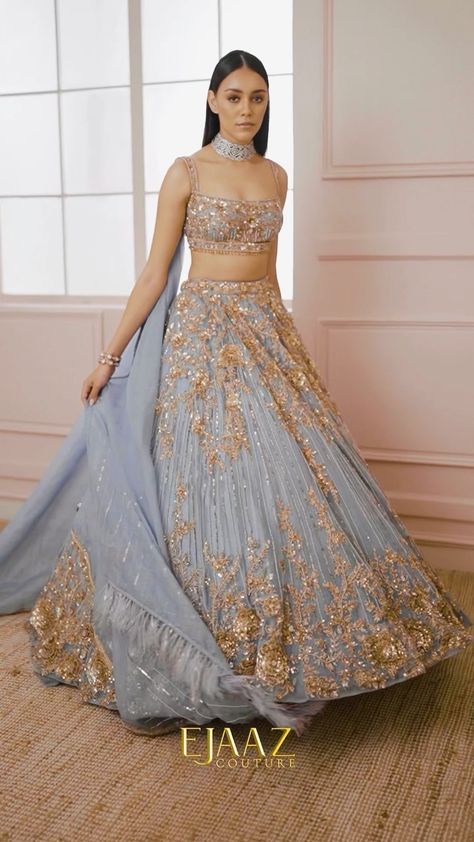 Ejaaz Couture on Instagram: "Our beguiling blue lehenga is dramatized with floral hand embroidery and geometric patterns and accentuated with an organza feather art dupatta Shop with us: ⚜️at our Flagship Store : D 33, First Floor, Defence Colony, New Delhi - 110024 ⚜️Whatsapp : +91-9873789288 ⚜️Website : Link in the bio ⚜️Virtual Consultant : +91-9873789288 For inquiries & appointments, Call/whatsapp : +91-9873789288 __ #womaninlovebyejaaz #ejaazcouture #bridallehenga #lehenga #lehengacholi # Blue Mehndi Outfit, Ejaaz Couture Lehenga, Ejaazcouture Bridal, Ejaazcouture Lehenga Bridal, Blue Reception Lehenga, Ejaazcouture Lehenga, Sangeet Bridal Outfit, Blue And Gold Lengha, Blue Lehenga Bridal