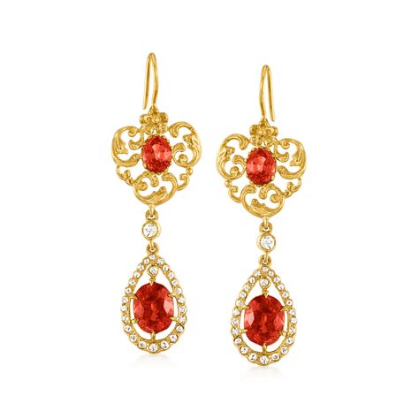 Ross-Simons - C. 1980 Vintage 7.10ct t. w. Spessartite Garnet, .50ct t. w. Diamond Drop Earrings. C. 1980. Here's a regal pair that hosts unmissable flair. From our Estate collection, the ornate double-drop earrings feature intricate scrollwork designs bejeweled with captivatingly radiant oval spessartite garnets, totaling 7.10 carats, and enhanced by the shimmer of .50 ct. t. w. round rose-cut diamonds to finish. Crafted in 18kt yellow gold. Hanging length is 2". Earwire, diamond and spessartit Jewel Design, Spessartite Garnet, Precious Gemstones Jewelry, Rings Rings, Diamond Drop Earrings, Jewelry Diamond, Rose Cut Diamond, Rose Cut, Diamond Jewelry