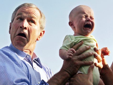 Former President George W. Bush looks about as unenthused as this baby. - Jim Bourg/Reuters Kejriwal Funny, Awkward Funny, George W Bush, George Bush, She Wolf, King Of Pop, Baby Crying, World Trade Center, Cannes Film Festival