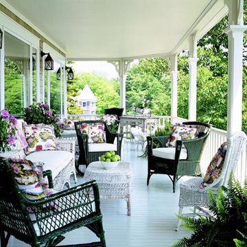 There is no better way to boost your curb appeal than a grand front porch! More cottage-style home ideas: http://www.bhg.com/home-improvement/exteriors/curb-appeal/cottage-style-home-ideas/?socsrc=bhgpin061813porch?page=4 Whicker Chair, Southern Porches, Sun Rooms, Cottage Porch, Porch Living, Building A Porch, Cottage Style Home, Aesthetic Garden, Summer Porch