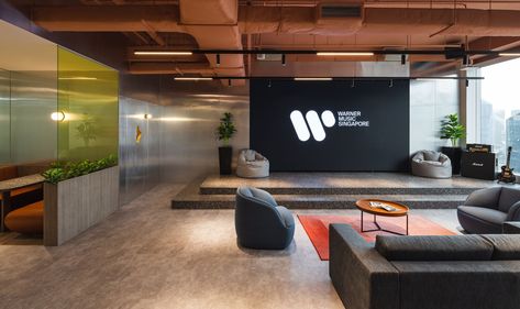 Warner Music Offices - Singapore Fabric Covered Walls, Stainless Steel Panels, Office Lobby, Booth Seating, Modular Lounges, Colored Ceiling, Architecture Magazines, Glass Partition, Terrazzo Flooring