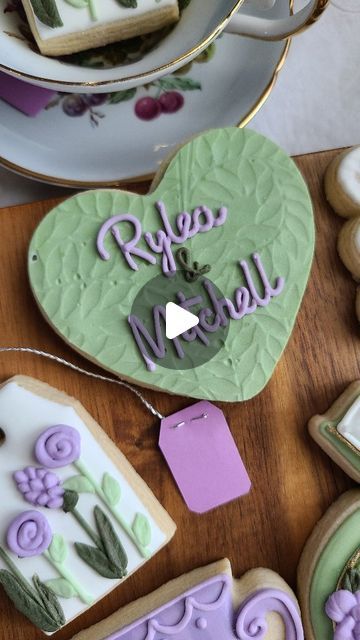 Marlene Matos-Jones on Instagram: "Texturing Royal Icing with paper!💚💜🌿💍💚💜🌿💍💚💜🌿  Maybe I'm late to the party, but I finally tried the Sugar Bakes impression paper by  @sugarlovebakingsupplies and @lucie.bakes purchased on @Emma’s Sweets online shop, and I absolutely loved how they turned out!  Before this, I only used this technique with crinkled up parchment paper, but now I love that I can give icing different looks and textures like this "leafy vine" pattern that was perfect for this floral bridal shower set! The best part is that these papers are reusable!   Don't forget to support @Cat Janice on tiktok, whose proceeds from this song go to her son's future as she fights through cancer. Sending all the love her way!   #CapCut  #catjanice #greatsong #cookiedecoratingvideos #co Cat Janice, Late To The Party, Cookie Videos, Cookie Tutorials, Vine Pattern, Cookie Do, Floral Bridal Shower, Floral Bridal, Decorated Cookies