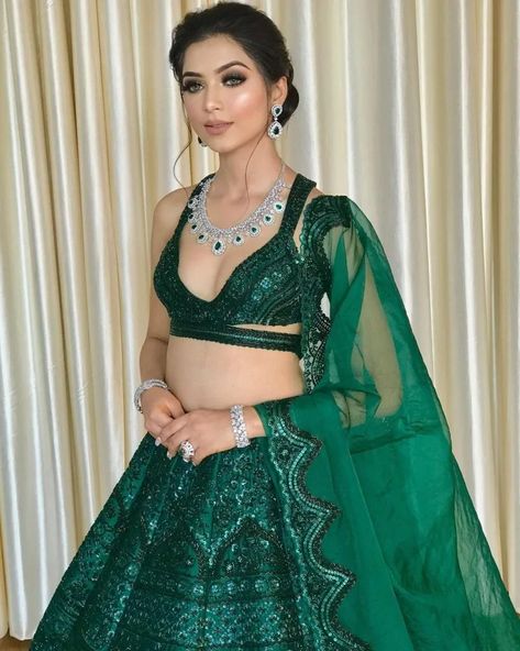 Top 50 Bridal Earring Ideas To Elevate Your Wedding Look Lehengas For Bride, Reception Lehengas, Dark Green Lehenga, Green Dress Makeup, Bridal Lehenga Designs, Bridal Earring, Green Lehenga, Long Kurti Designs, Traditional Indian Outfits