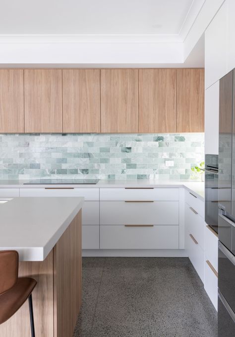 Green Marble Subway Tile Backsplash with Two-Tone Cabinetry and White Countertops
Marble backsplashes are popularly paired with white quartz countertops that orchestrate a sleek and solid look like they do in this contemporary kitchen. Backsplash Tile Layout, Green Tile Backsplash, Backsplash Kitchen White Cabinets, Stone Tile Backsplash, White Quartz Countertops, Green Backsplash, Modern Backsplash, Kitchen Backsplash Tile, Tile Layout