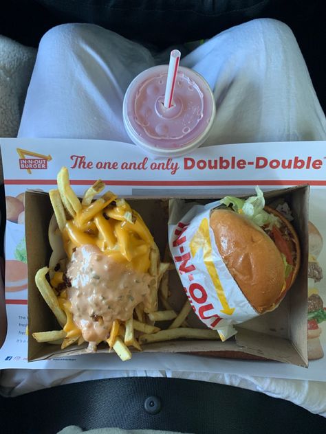 In-n-out burger and fries animal style with a pink lemonade to go. Aerial view of meal on lap In In Out, Usa Fast Food, In And Out Aesthetic, In And Out Burger Aesthetic, In And Out, In N Out Aesthetic, In Out Burger, Fast Food Lunch, Fast Food Burger