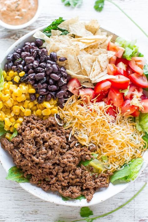 Ground Beef Taco Salad Bowls (+ Homemade Taco Bowls!) - Averie Cooks Ground Beef Burritos, Beef Taco Salad, Frito Taco Salad, Creamy Cilantro Lime Dressing, Taco Salad Recipe Healthy, Big Mac Salat, Easy Taco Salad Recipe, Taco Salad Doritos, Creamy Cilantro Dressing