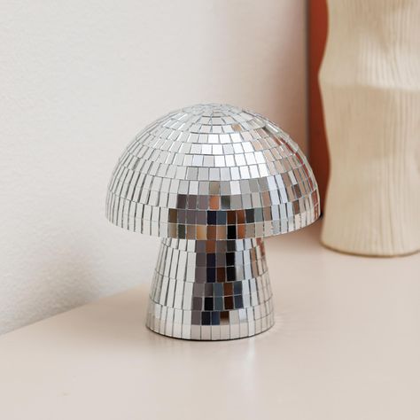 PRICES MAY VARY. Unique Design: Its distinctive blend of natural mushroom shape with a dazzling disco ball exterior offers a unique design element that's hard to find elsewhere, This disco ball mushroom's height 4.9in, wide 4.8inch full-covered mirror glass tiles and No assembly reuqired. Quality Craftsmanship: Mushroom Disco Ball is made with attention to detail and quality materials, it promises durability and a lasting aesthetic appeal, ensuring that it remains a staple in your decor for year Mushroom Disco Ball, Disco Mushroom, Mushroom Decorations, Handmade Mirror, Retro Disco, Ball Lamps, Glitter Decor, Mushroom Decor, Unique Shapes