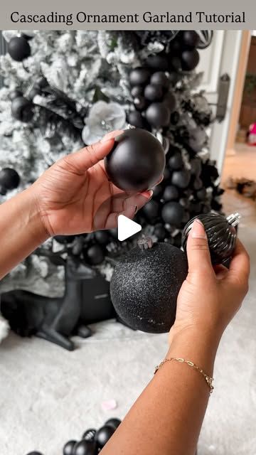 Tina Meeks on Instagram: "How to create Cascading Ornament Garland + Luxe Design Tree Look...  SAVE this for inspiration for decorating your Christmas tree. You’ll need floral wire + ornaments of different sizes and some patience. I went with black but it’ll look amazing in any color.   I used 15-20 ornaments per cluster. About 8 full clusters on this 7.5 foot tree. Be sure to double loop the first and last ornament or they’ll slide all over the place. Happy Decorating!!🖤" Black Blue Christmas Tree, Cascade Ornaments On Tree, Bulb Cluster On Tree, Grouping Christmas Balls On Tree, Flocked Tree With Black Ornaments, Cascading Christmas Ornaments, Christmas Tree Ornament Garland, Bauble Cluster On Tree, Cascading Ornaments On Tree