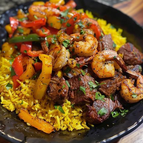 🌶️🥩 Experience the bold flavors of Jerk Steak & Shrimp over Yellow Rice. An exotic, delicious fusion. #JerkFusionFeast Jerk Steak & Shrimp over Yellow Rice Ingredients: Steak, sliced (1 lb) Shrimp, peeled (1 lb) Jerk seasoning (2 tbsp) Yellow rice, cooked (2 cups) Bell peppers, sliced (1 cup) Onion, sliced (1) Instructions: Season steak and shrimp with jerk seasoning. Sauté steak, shrimp, peppers, and onion. Serve over yellow rice. 🍤🥘 Dive into a meal that's bursting with Caribbean flair. P... Jerk Steak, Chili Cheese Dog Recipe, Season Steak, Shrimp Peppers, Beef Tri Tip, Steak Shrimp, Angus Steak, Steak And Shrimp, Baked Dinner