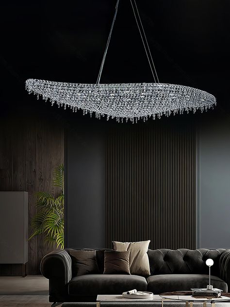 The Boat Crystal Chandelier is an epitome of modern sophistication and a true testament to craftsmanship in contemporary lighting design. With its sleek, boat-like silhouette, this chandelier captivates with a wave of shimmering crystals, carefully suspended from a durable metal and aluminum frame. 
 Embodying luxury and grace, the chandelier's elongated form stretches across the space like a vessel on a tranquil sea of light. The carefully selected crystals are meticulously arranged to catch and reflect every beam, emitting a spectrum of radiant, sparkling light that dances across the room. Its grand presence is both an illuminator and a centerpiece, perfect for gracing the overhead space of dining areas, grand entrances, or high-ceilinged living rooms. 
 This Boat Crystal Chandelier is m Modern Luxury Lighting, Grand Entryway, Contemporary Lighting Design, Hall Lighting, Tri Colour, Sparkling Lights, Luxury Dining Room, Crystal Light, Luxury Lighting