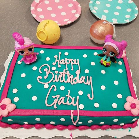 This is a Wal-Mart Doc McStuffins birthday cake without the kit. The white dots are edible eyeballs upside down. I sunk in two LOL dolls. This is 1/4 sheet cake. Lol Sheet Cakes Birthday, Lol Sheet Cake, Edible Eyeballs, Doc Mcstuffins Birthday Cake, Lol Surprise Cake, Walmart Cakes, Lol Doll Cake, 8th Birthday Cake, Doc Mcstuffins Birthday