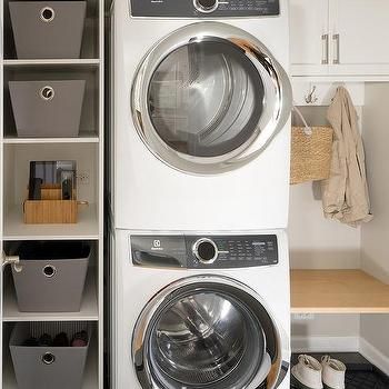 Vertical Shelving Unit Next to Stacked Washer and Dryer Stackable Washer Dryer Laundry Room, Washer Dryer Laundry Room, Industrial Shelves, Custom Laundry Room, Stacked Laundry Room, Tiny Laundry Rooms, Small Laundry Room Organization, Room Storage Diy, Laundry Room Closet