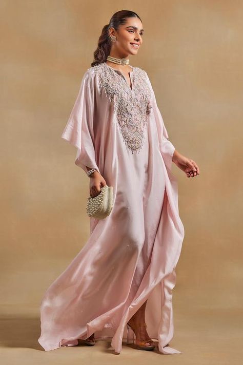 Baby pink kaftan, highlighted with beads, crystal embellished yoke and chantilly lace detailing.
Components: 1
Pattern: Embellished
Type Of Work:  Beads, Crystals
Neckline: Notched Neck
Sleeve Type: Three Quarter Sleeves
Fabric: Habutai Silk, Chantilly Lace
Color: Pink
Other Details: 
Model height: 5ft 8inches, wearing size M
Note: The bag shown in the image is not for sale

Occasion: Sangeet - Aza Fashions Latest Kaftan Designs, Pink Kaftan, Kaftan For Women, Kaftan Designs, Muslim Couple Photography, Silk Kaftan, Designer Party Wear Dresses, Indian Clothes, Dresses Ideas