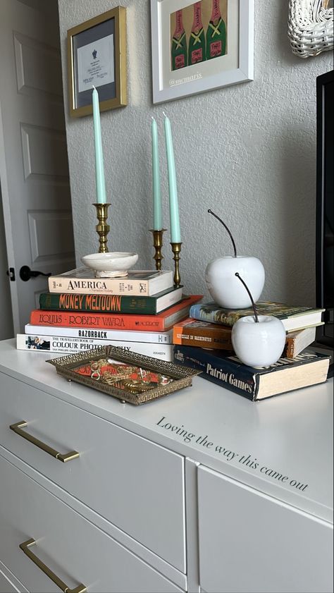 Books On Dresser Bedrooms, Candle On Dresser, Tv Stand Decor Aesthetic, How To Style Books, Top Of Dresser Decor Bedroom Ideas, Books On Dresser, Dresser Decor Bedroom Ideas, Dressor Decor, Top Of Dresser Decor Bedroom