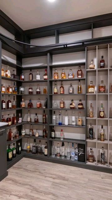 Closet Factory Colorado on Instagram: "Smooth and sweet is right! A custom whiskey room that dreams are made of! Design by: Cindy Schumacher Photos by: @libbie_martin #whiskey #tennessee #display #customstorage #closetgoals #closetorganization #closetfactory #denvercolorado #denverdesign #interiordesign #makeover #beforeandafter #mudroom #wallbed #pantry #garage #homeoffice #organize #homeorganization #refresh #trending #coloradolife" Whiskey Closet, Pantry Garage, Closet Factory, Library Bar, House Basement, Whiskey Room, Basement House, Custom Storage, Wall Bed