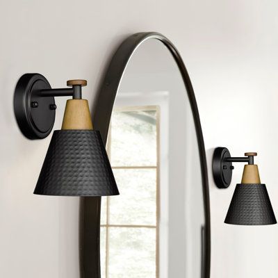 This set of two armed sconces adds a mixed-material look to your space with its wood grain paint finish and hammered metal shade. The clean design suits various settings, from adorning a mirror or bed to lining a hallway or enhancing a covered porch or patio. Each sconce features a cone-shaped shade crafted from wood and metal for an industrial vibe we love. With room for two standard bulbs up to 60W each (not included), these sconces provide a downward light direction for a calming atmosphere. Barnwood Accent Wall, Hotel Hallway, Black Sconces, Den Ideas, Design Boards, Crystal Wall Sconces, Light Bedroom, Industrial Chandelier, Wall Lights Bedroom