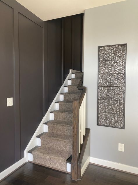 The entry stairwell in the Barnhart Crib just got a whole lot more interesting with our new custom board and batten wall by Battle Building LLC! Life is way to short to be boring. #graywalls #darkgraywalls #entryway #staircase #customwoodwork #boardandbatten #jaybattle #BattleBuildingLLC Board And Batten Stairwell Entryway, Boring Stairwell, Board And Batten Wall Stairways, Board And Batten Stairwell, Board And Batten Staircase, Batten Staircase, Entry Stairway, Batten Entryway, Stairway Makeover