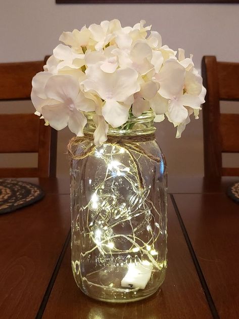 Mason Jar With Lights, Jar With Lights, Wedding Centerpieces Mason Jars, Fairy Lights Wedding, Lighted Centerpieces, 50th Wedding Anniversary Party, Senior Ideas, Moms Birthday, Jar Centerpieces