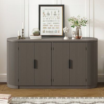 The sophisticated look of the vertical striped cabinet doors allows the sideboard to seamlessly blend into various interior styles, from contemporary to traditional. Its versatility in design makes it an ideal piece for dining rooms, living areas, or hallways. The sideboard features cabinet doors with vertical stripes, creating a sleek and modern aesthetic. These vertical lines add a sense of height and sophistication, enhancing the visual appeal of the piece. Behind the stylish vertical striped Striped Door, Console Table Entryway, Accent Chests And Cabinets, Vertical Design, Brown Living Room, Vertical Lines, Sideboard Furniture, Door Storage, Dining Room Bar