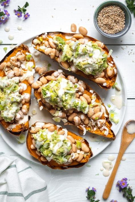 Stuffed Sweet Potato with White Bean and Guacamole | TWO SPOONS Recipes With Guacamole, Stuffed Recipes, Potatoes Stuffed, Stuffed Sweet Potato, Potato Stuffed, Stuffed Sweet Potatoes, Healthy Potatoes, Sweet Potato Skins, Easy Guacamole