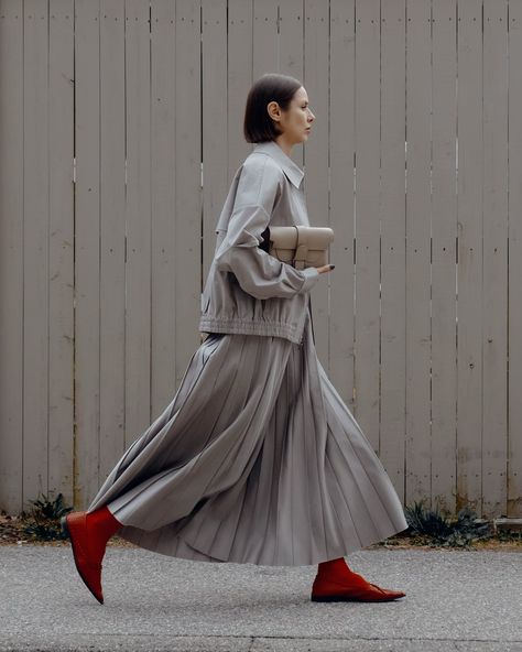 Striding in @tibi with a pop of red @cosstores #tibi #cos #OOTD Wearing: Jacket & Skirt: @tibi shoes: @cosstores Bag: @senreve Official Wear, Wearing Jacket, Winter Moodboard, Dresses Everyday, Pop Of Red, Corporate Attire, Red Skirts, Everyday Dresses, Pleated Skirt