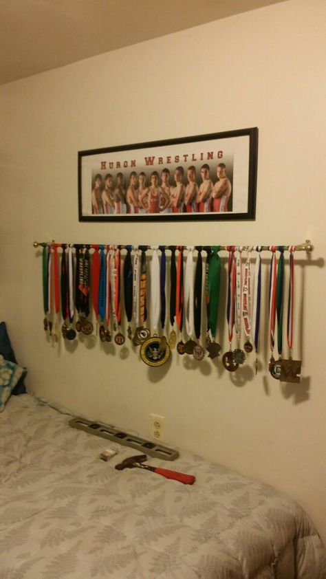 Hanging my son's wrestling medals Wrestling Awards Display, Ideas For Medals Display, Wrestling Theme Bedroom, Wrestling Medal Display Ideas, Wrestling Bedroom Ideas, Wrestling Room Ideas, Wrestling Aesthetic, Animal Mounts, Metal Boy