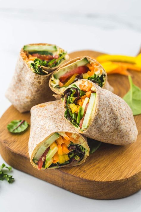 Do you not have enough time to prepare a full meal for your lunch? Then do not fret because lunch wraps are easy to make yet filling to the tummy! With that said, here are 15 healthy and delicious lunch wraps you will love. #lunchwraps #healthyrecipes #lunchrecipes Wrap Recipes For Lunch, Healthy Lunch Wraps, Wraps For Lunch, Panini Recipes Chicken, Vegetarian Wraps, Wraps Recipes Healthy, Hummus Wrap, Boiled Chicken Breast, Lunch Wraps