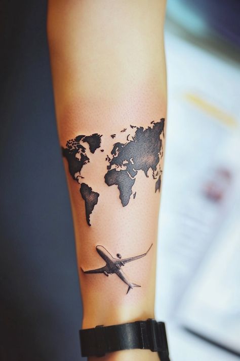 Forearm tattoo of a world map with an airplane underneath. Unique Women’s Tattoos, Travel Tattoo Ideas For Women, Travel Tattoos For Women, Wanderlust Tattoos, Compass And Map Tattoo, Travel Tattoo Ideas, World Map Tattoos, Skyline Tattoo, Saturn Tattoo