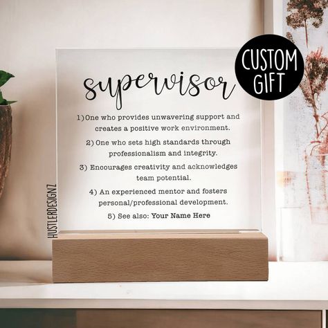 Introducing our heartfelt Supervisor Definition Personalized Plaque, a perfect gift that pays tribute to the incredible impact of the leaders and mentors in our lives. This versatile plaque can be given to both men and women, making it a thoughtful and inclusive gift idea for any leader. Why We Think You'll Love This Plaque: 👍 Personalized Touch: Customize with the recipient's name and/or a special message for a truly unique and meaningful gift. 👍 LED Base Options: Choose between a USB plug-in LED base or a cordless battery-operated LED base (requires 2 AAA batteries, not included). Both bases feature 7 vibrant colors and dynamic lighting cycles. 👍 High-Quality Materials: Made from durable acrylic for a sleek and polished look. Product Specifications * Total Dimension with wooden base: Supervisor Gifts Ideas, Gifts For Supervisor, Supervisor Gifts, Personalized Plaques, Positive Work Environment, Team Leader, Diy Dress, Appreciation Gifts, Thank You Gifts