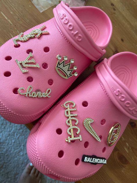 Jibitz crocs pink channel Gucci shoes designer wear Nike beliciaga charms Bling Croc Charms, Croc Widgets, Balenciaga Track Outfit Men, Croc Charm Ideas, Crocs Meme, Balenciaga Track Outfit, Pink Croc Charms, Charm Crocs, Croc Ideas