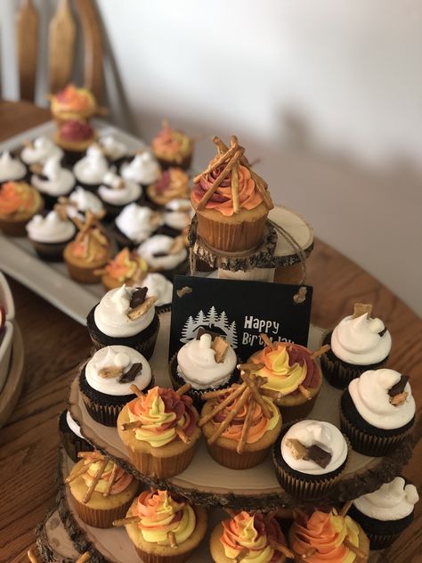 Campfire Theme Cupcakes, Camping Theme Cupcake Ideas, One Happy Camper Birthday Cupcakes, S’mores 1st Birthday, Camping Birthday Cupcakes, Campfire Bday Party Ideas, Camp Fire Themed Birthday Party, Smores 1st Birthday Party, One Happy Camper Food Table