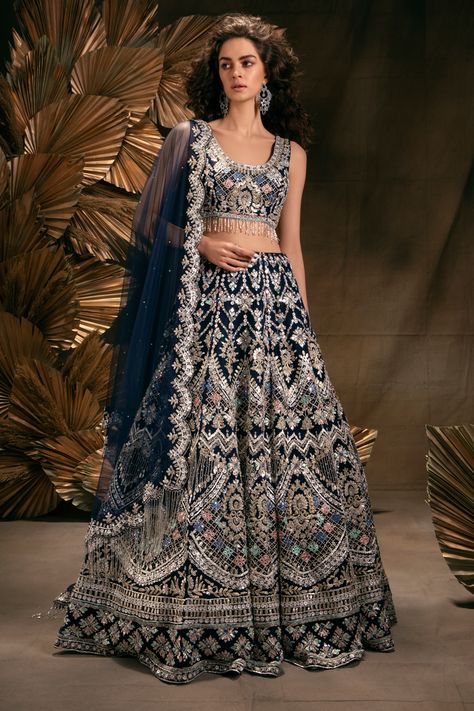 NAVY BLUE LEHENGA SET WITH MULTI COLOURED EMBROIDERY AND GOTA WORK PAIRED WITH A MATCHING SCALLOPED DUPATTA AND BEADED TASSELS. - Seasons India Reception Lehenga Bridal Indian, Blue Indian Wedding Dress, Reception Lehenga Bridal, Reception Dress Indian, Blue Bridal Lehenga, Indian Wedding Reception Outfits, Royal Blue Lehenga, Navy Blue Lehenga, Wedding Reception Outfit