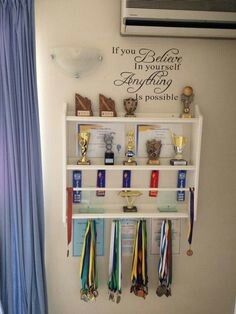 Medals And Certificates Display, Dance Trophy Shelf, Ribbon And Trophy Display Ideas, Trophy Ribbon Display Ideas, Race Ribbon Display, Display Awards Ideas, How To Display Ribbons And Medals, Trophy And Metal Display Ideas, Basketball Trophy Display Ideas