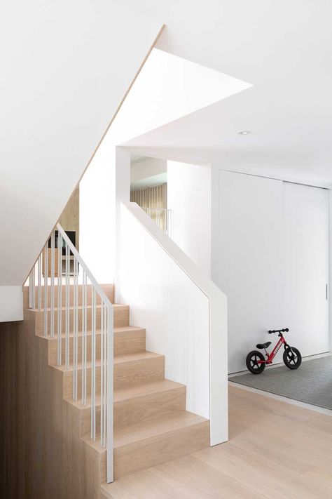 A split level home has gone from cramped and dated to spacious and connected | Livingetc Light Oak Hardwood Floors, 1960s Architecture, Scandinavian Flooring, Split Level Home, Prairie House, House Staircase, Interior Staircase, Split Level House, Modern Stairs