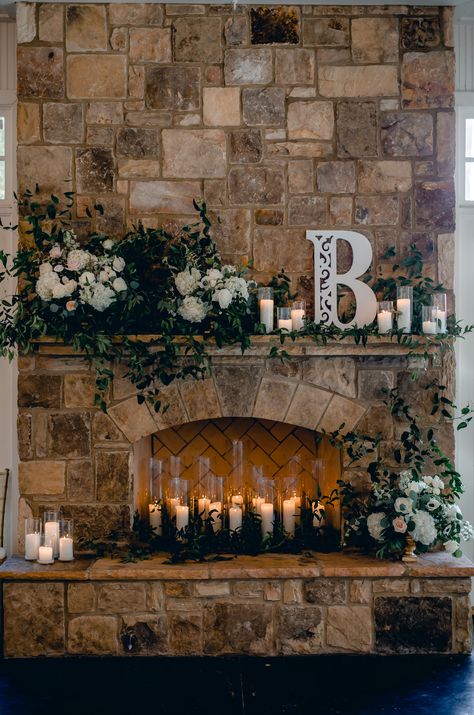 Romantic Sunday Wedding at Little River Farms | Milton, Georgia | Candles in wedding fireplace and lots of greenary and flowers Sweetheart Table Wedding With Fireplace, Wedding Venue With Fireplace, Mantle Decor Wedding Fireplace, Fireplace Mantle Decor Wedding, Fireplace Decor Wedding Receptions, Fireplace Mantel Wedding Decor, Sweetheart Table In Front Of Fireplace, Wedding Photo Backdrop Ideas Receptions, Wedding In Front Of Fireplace