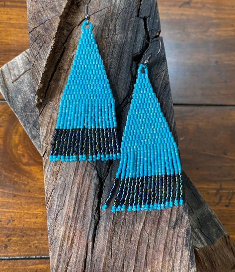 "Fun to wear turquoise earrings with an eye catching iridescent black stripe across the fringe. - The model is my beautiful daughter who is 5' 2\" and they look lovely on her.  - The body of the earring is a beautiful matte iridescent turquoise  with an iridescent gunmetal gray/black stripe across the flat edged fringe. - Made with high quality Delica glass beads. - Gray ear hooks with clear rubber back. - 3.5 inches long including ear hook.  1.2 inches wide." Straight Fringe, Fringe Beaded Earrings, Stained Glass Earrings, Iridescent Black, Turquoise And Black, My Beautiful Daughter, Gunmetal Grey, Beaded Dangle Earrings, Moon Earrings