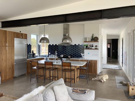 Photo 9 of 9 in Monk Place by Dan Drury - Dwell Concrete Floor Wood, Floor Wood, Engineered Quartz, Quartz Counter, Drop In Sink, Wood Cabinet, Concrete Floor, Range Hood, Ceiling Lighting