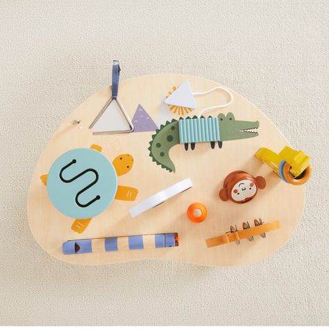 Let your little one's musical talents shine with the pint-sized Wonder & Wise Mini Music Maker! This set includes a giraffe rattle, hippo tambourine, snake whistle, elephant bead shaker, alligator ribbed xylophone, turtle drum, monkey castinet, and mountain triangle. Perfect for playtime or making a mini orchestra at the table! (Music skills not included, but may lead to hours of fun and creativity!) Room Wishlist, West Elm Kids, Music Toys, Unique Toys, Tambourine, Musical Toys, At The Table, Toddler Room, Montessori Toys