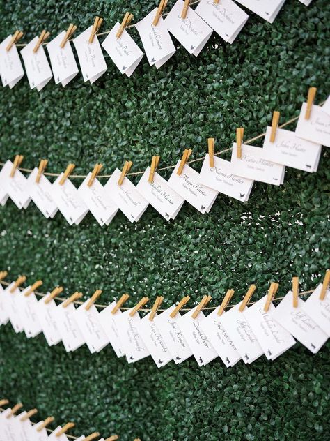 Wedding Escort Card Display Clothesline Hedge Wall Seating Arrangement Seating Chart On Greenery Wall, Name Card Display Wedding, Boxwood Wall Seating Chart, Hedge Wall Seating Chart, Seating Arrangement Wedding Display, Green Wall Seating Chart, Hedge Wall, Red Centerpieces, Candy Wedding